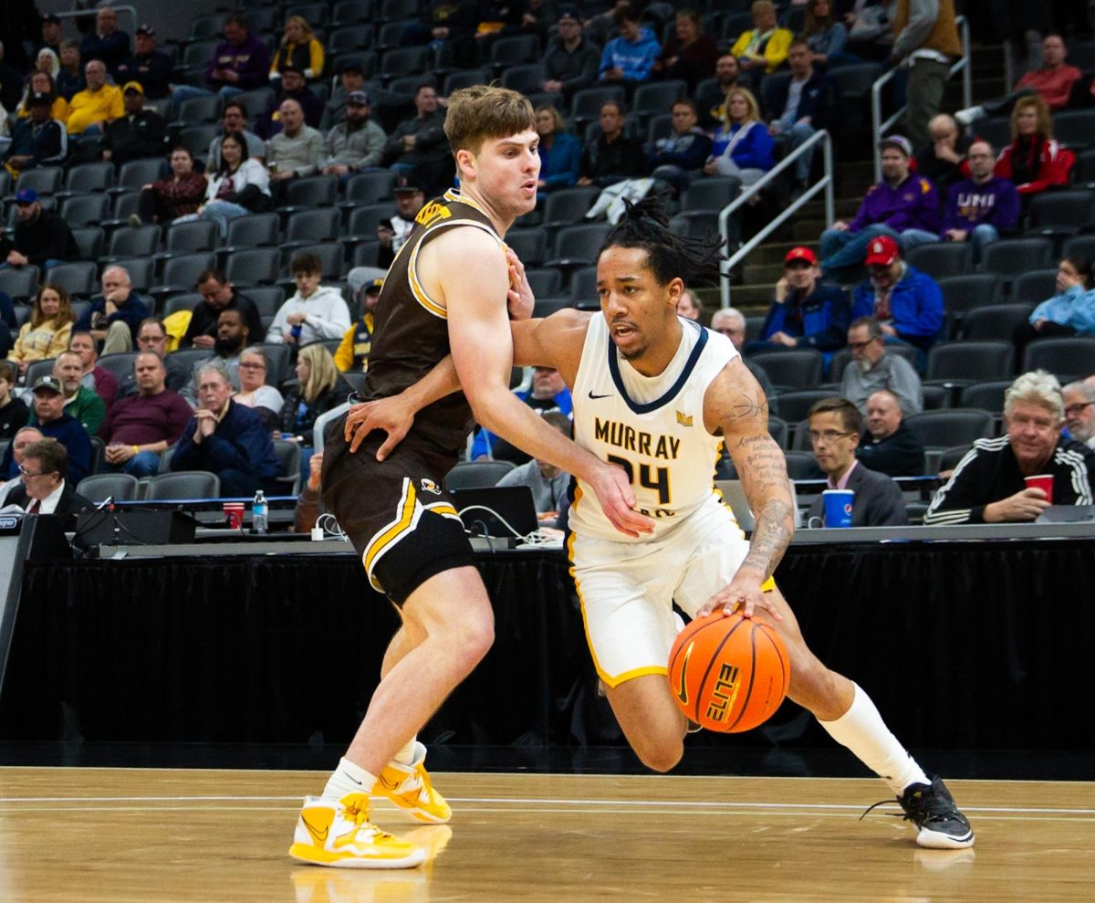 Junior guard JaCobi Wood drives past a Valparaiso defender to score in the first round of the MVC tournament. 
