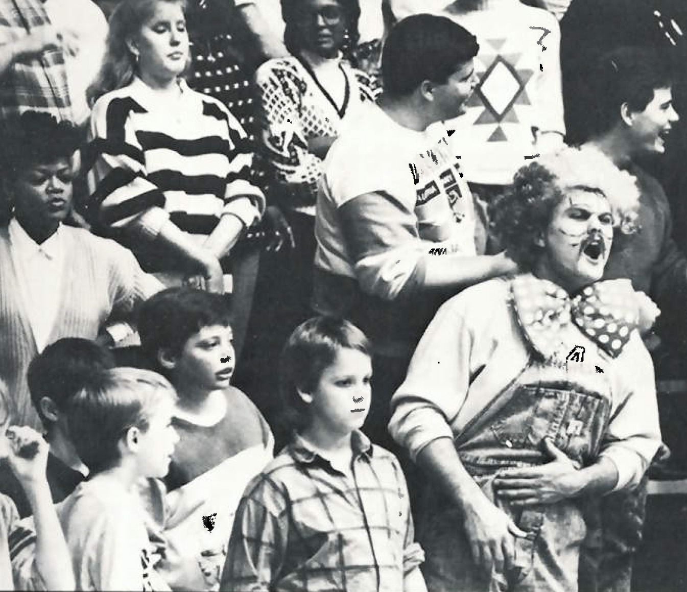 Fans cheer at a 1988 game in Racer Arena.