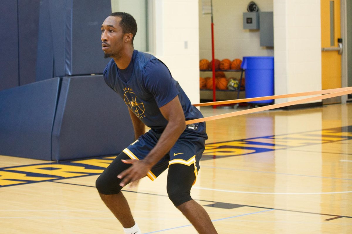 Senior guard Shawn Walker warming up before the Racers first practice.