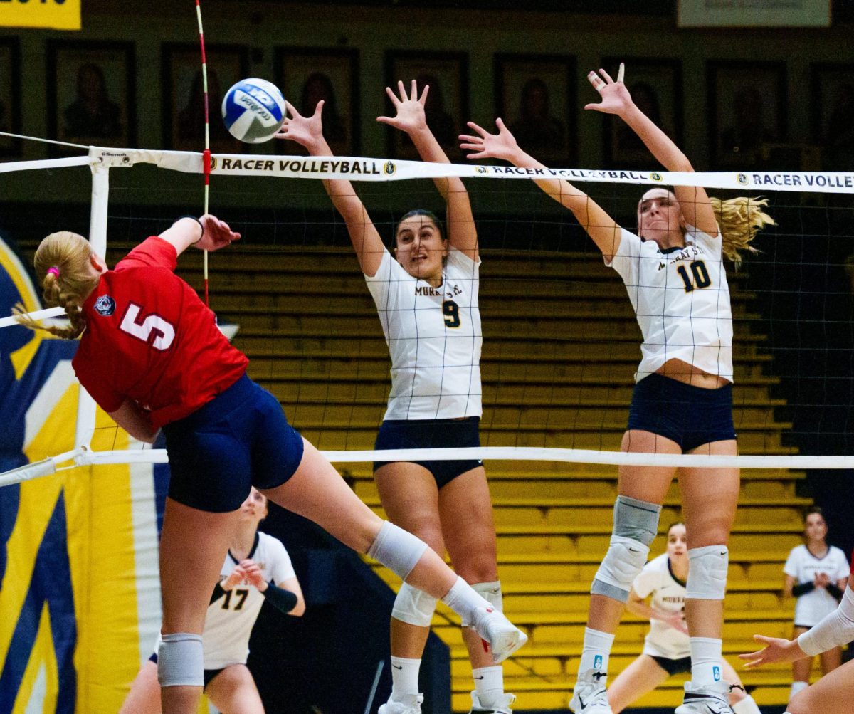 Federica Nuccio and Elisa Dozio try to block a hit from a Belmont player. (Nov. 15)