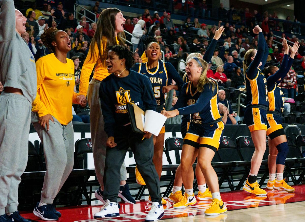 The bench celebrates a three-pointer during the game against Austin Peay.