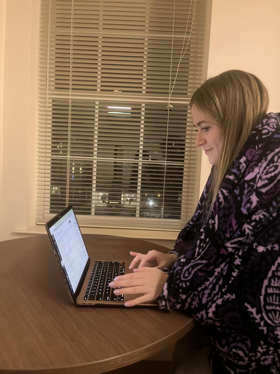 Franklin resident, Madison King, bundles up while working on assignments. 