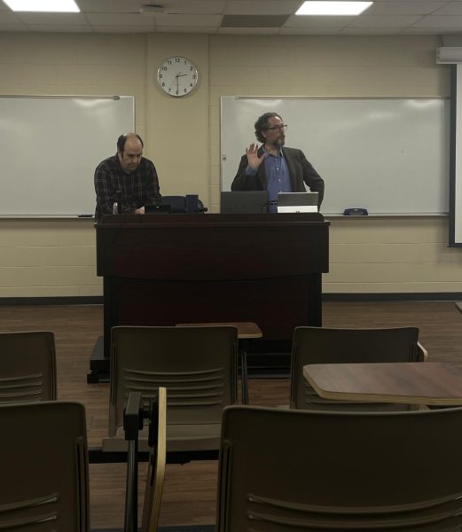 Michael Bordieri (left) and David Roach (right) discuss legislation impacting higher education. 