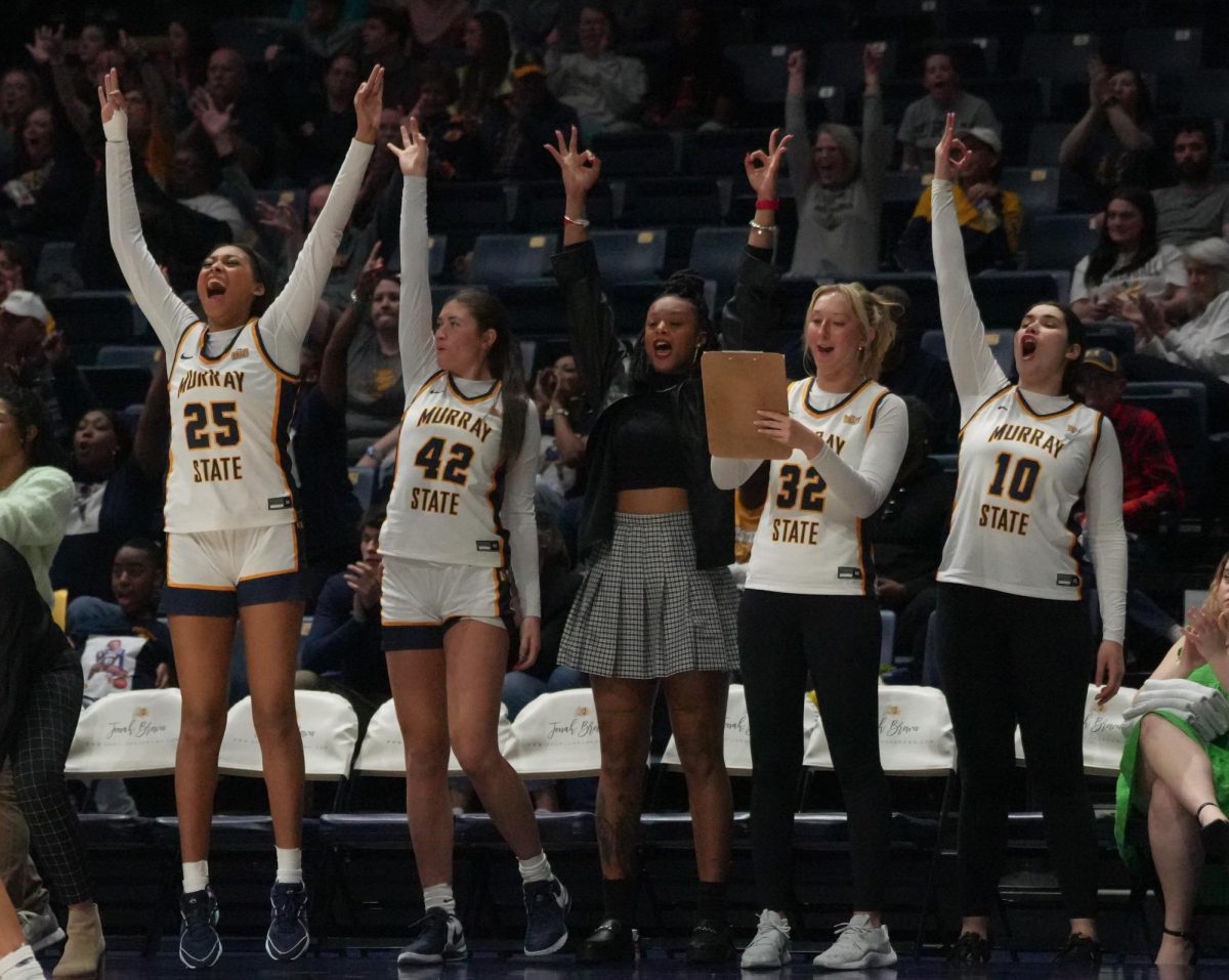 Murray State bench celebrates after a made three point shot. 