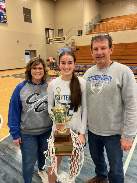 Evans with her husband Chris and daughter Elliot, after the Lady Rockets won the 2nd Region All A Classic in January. Photo courtesy of Allison Evans. 
