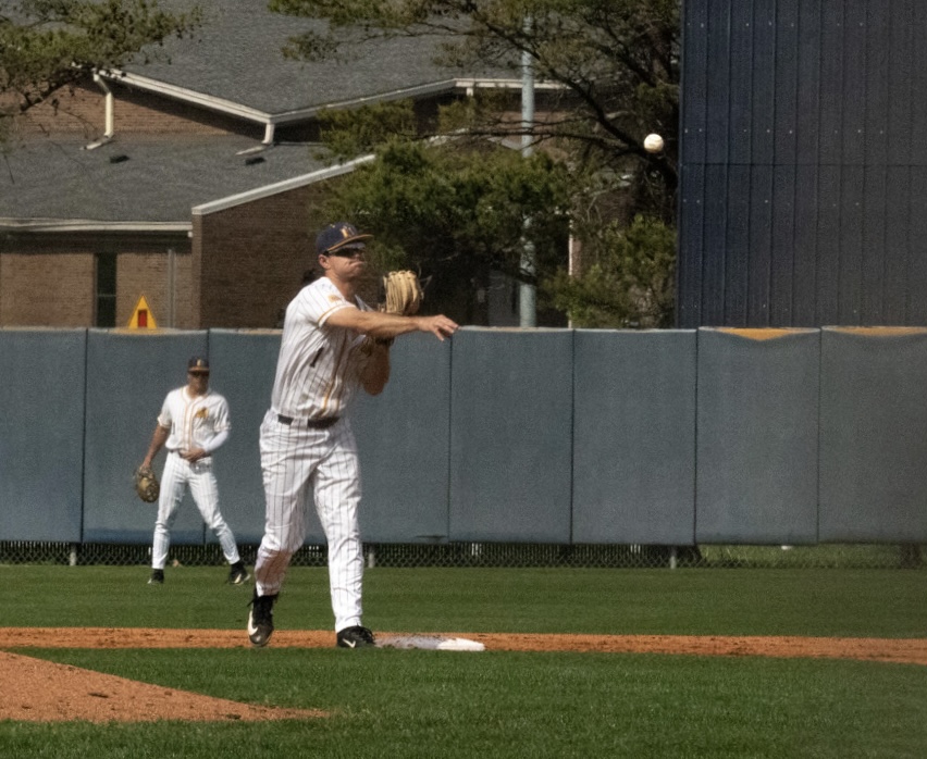 Junior infielder Riley Hawthorne throws the ball to first.