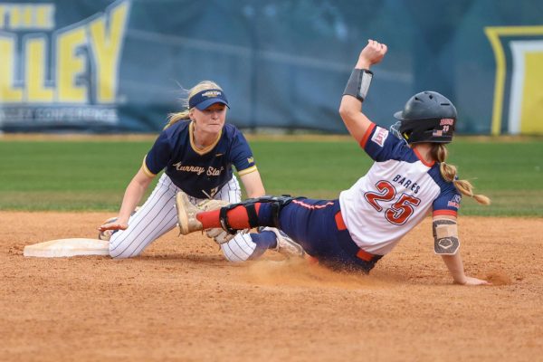 Freshman shortstop Parker Holcombe tags out a Belmont runner at second. 