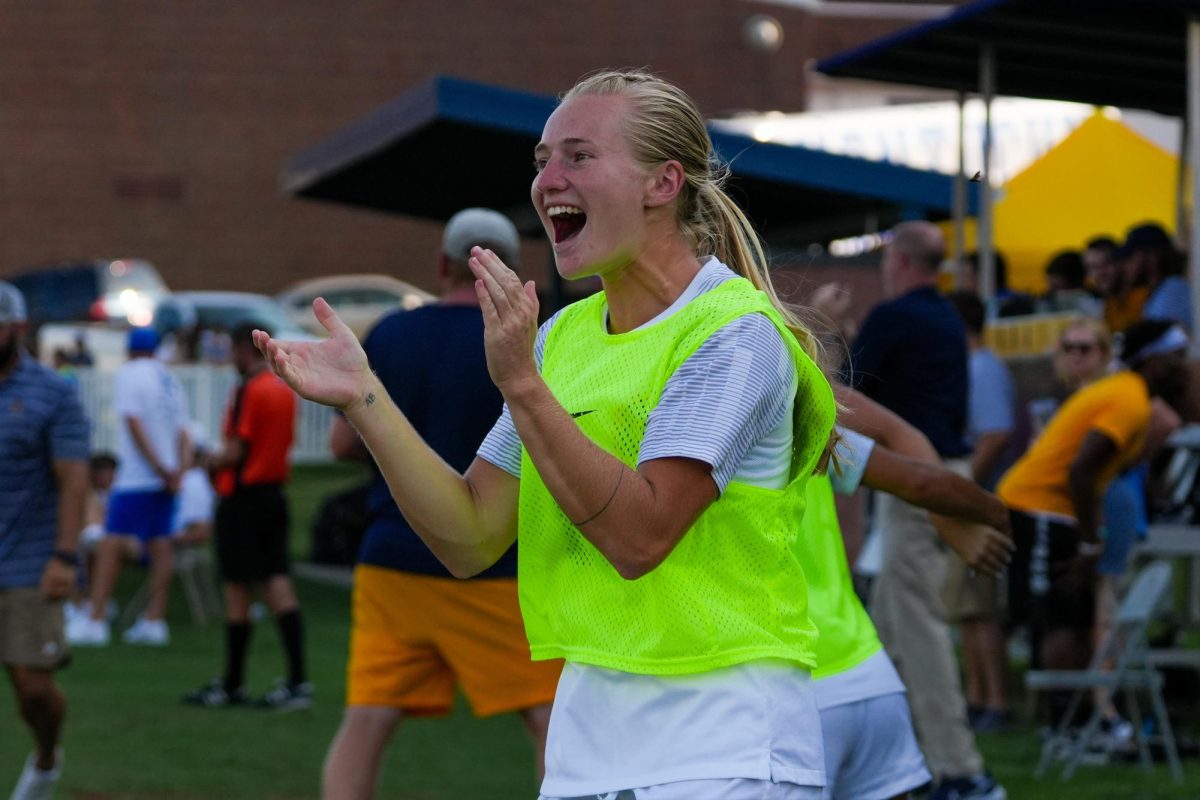 Senior forward Chloe Barnthouse cheers on her teammates while on the bench. Barnthouse totaled 14 goals and three assists during her time at Murray State.
