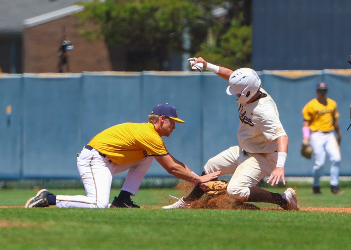 Vogel tags out a runner at second base. 