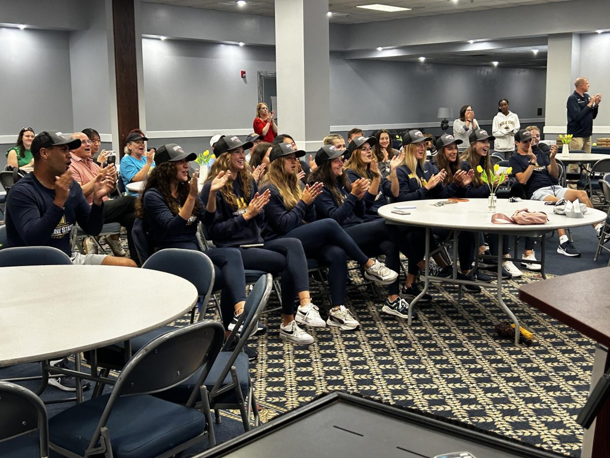 The Murray State tennis team celebrates its placement in the 2024 NCAA Tournament bracket.