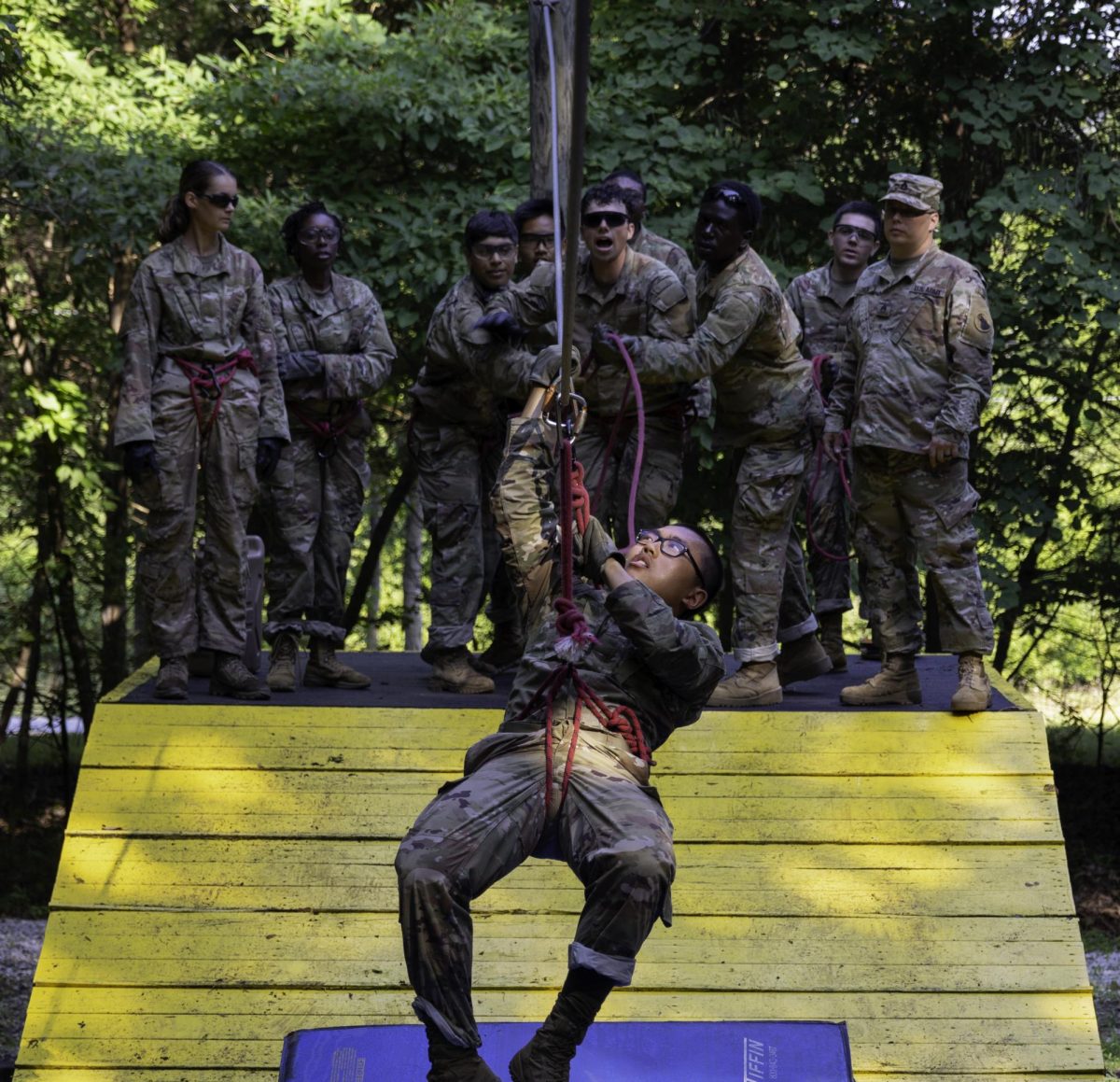 Basic camp cadets on base at Fort Knox participating on the team work development course undergo coverage for media production by the Cadet Summer Training Public Affair interns. 