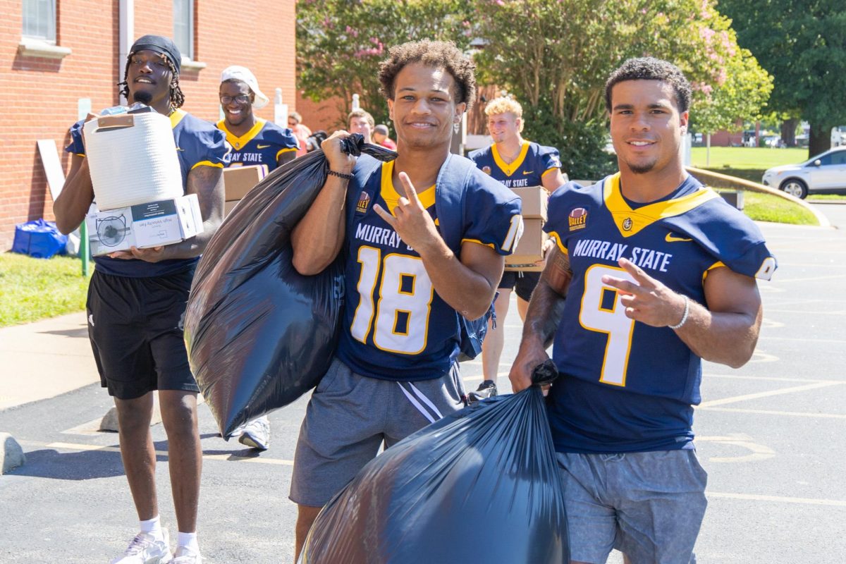 Marcus Floyd Jr., Kylan Galbreath, and other members of the Racers football team helped students move in on Saturday. 