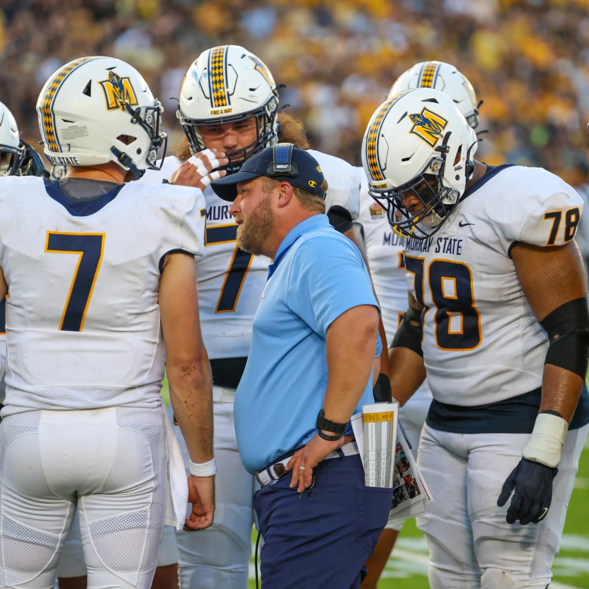 Head coach Jody Wright talks to his players during a timeout. 