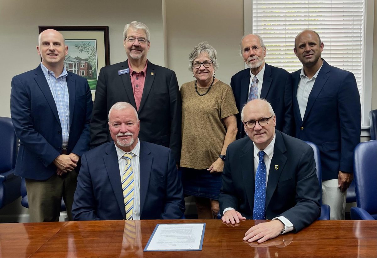 From left, Shawn Touney, Tim Todd, Jackie Dudley, Don Robertson, Jordan Smith, Jerry Penner and Bob Jackson signed an agreement with Murray Medical Associates for campus health services.