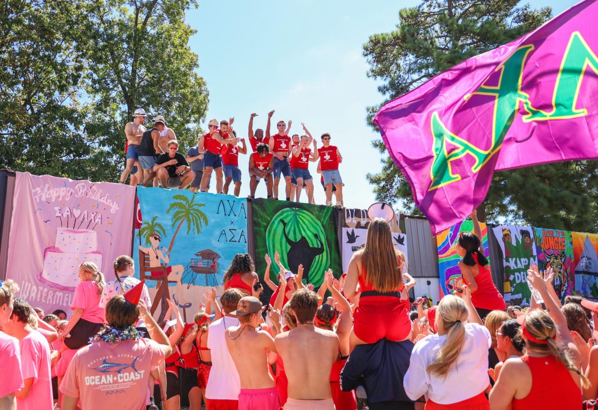 Wide shot of the brothers of Chop hype up the sororities before bust. 