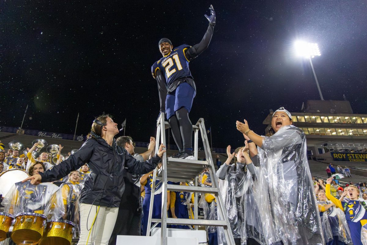 Senior defensive back Jayson Coley directed the Racer band for the fight song after the game. 