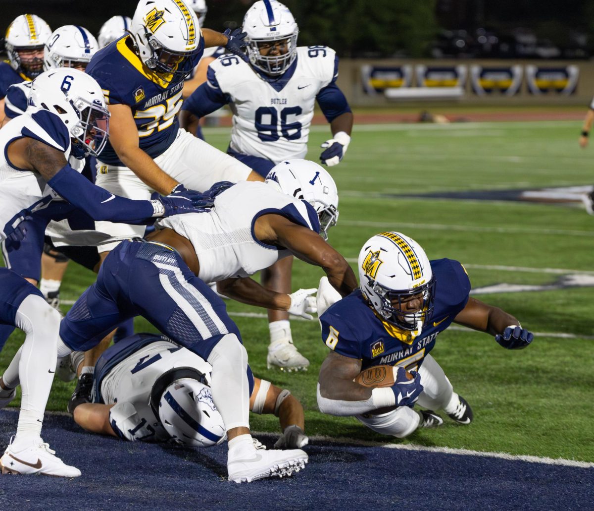 Graduate student running back Kywon Morgan dives across the line for a touchdown. 