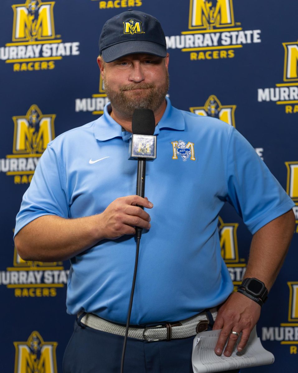 Head coach Jody Wright talks to reporters at the postgame press conference. 