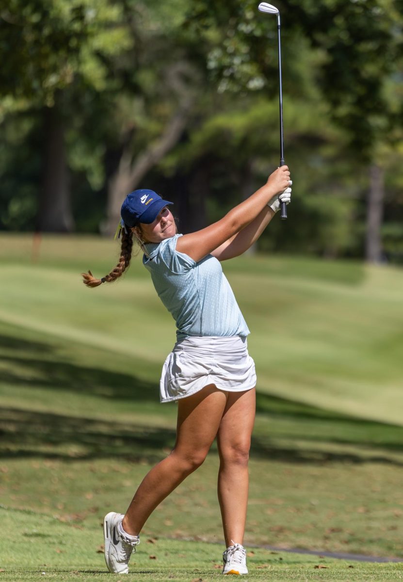 Sophomore Patti Patterson teeing off.