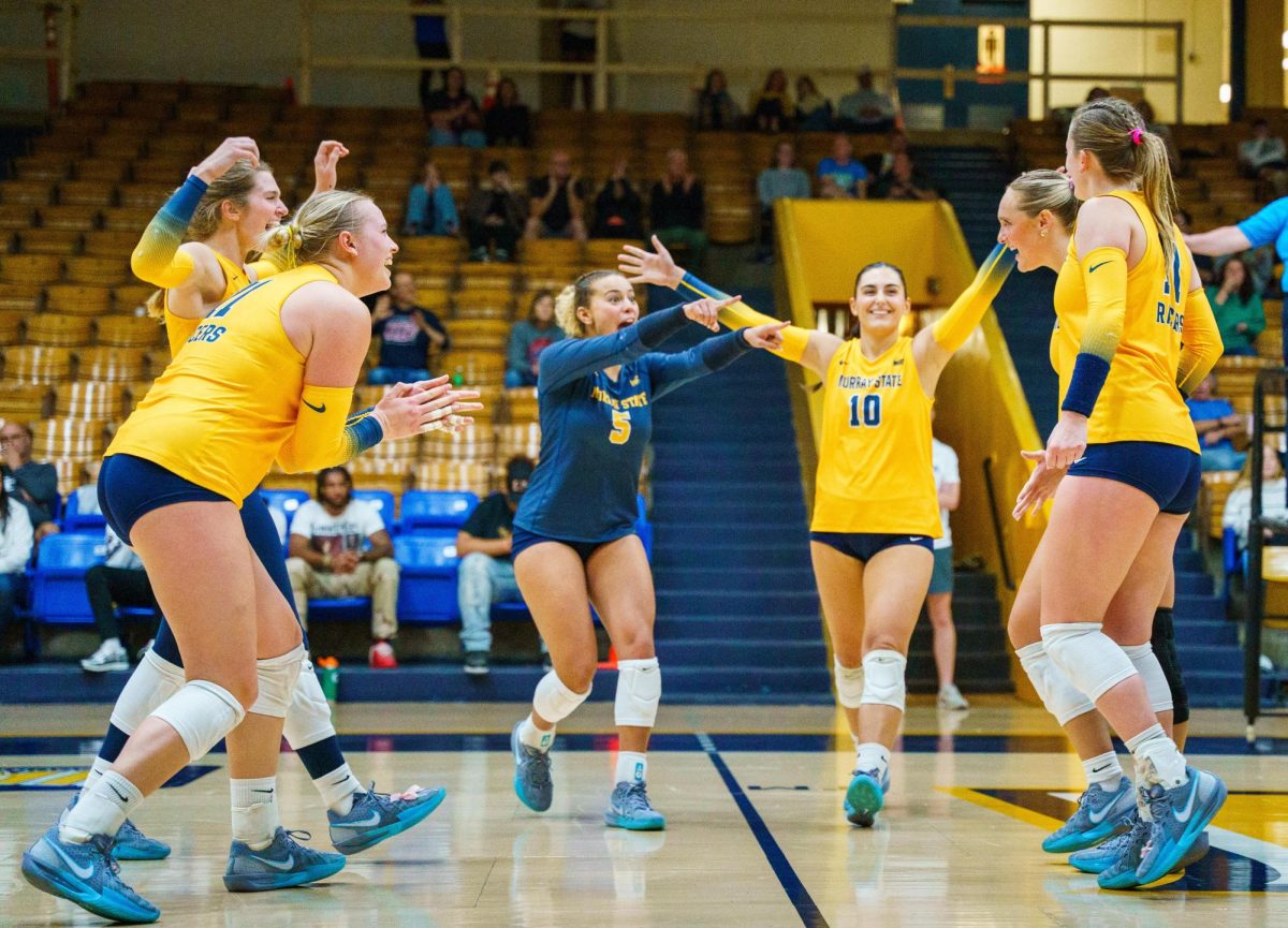 The Racers celebrate after scoring a point. 