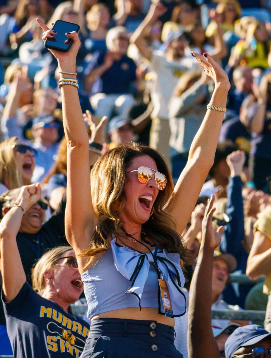 Meredith Wright, wife of head coach Jody Wright, celebrates after a Murray State touchdown.