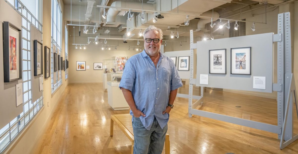 Photo courtesy of Ed Rode.
Ed Rode stands in his photography exhibition ‘Songwriter Musician’ in the Birthplace of Country Music Museum in Bristol, Virginia.