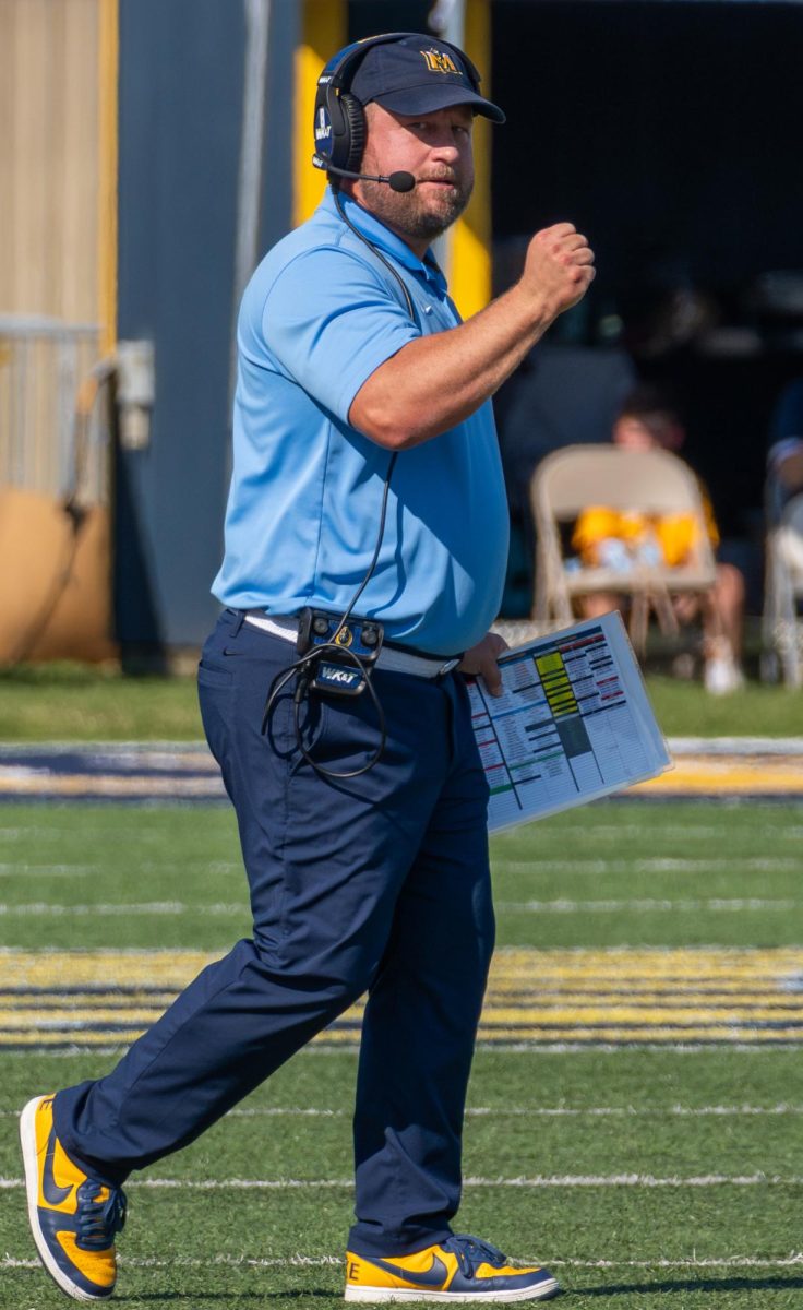 Head coach Jody Wright celebrating after Carter's catch.  