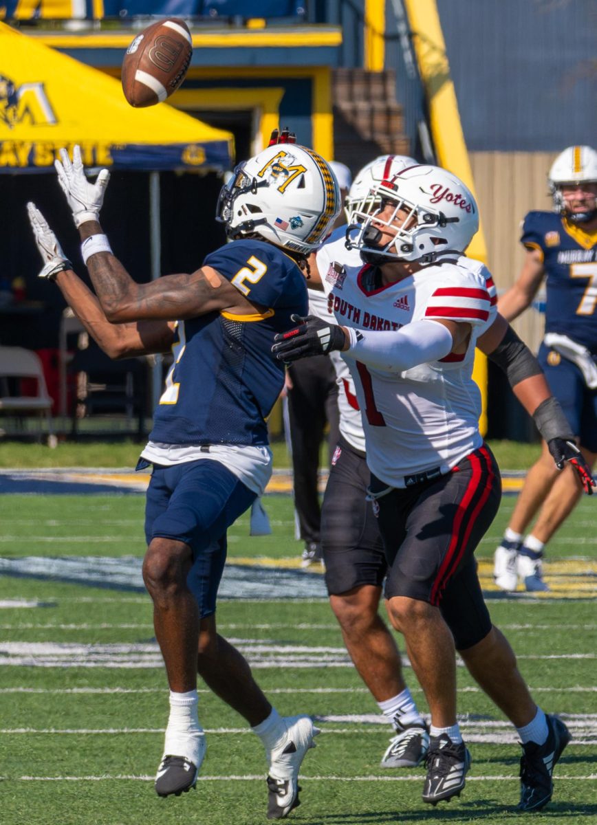 Junior wide receiver J'Kalon Carter catches a deep pass. 