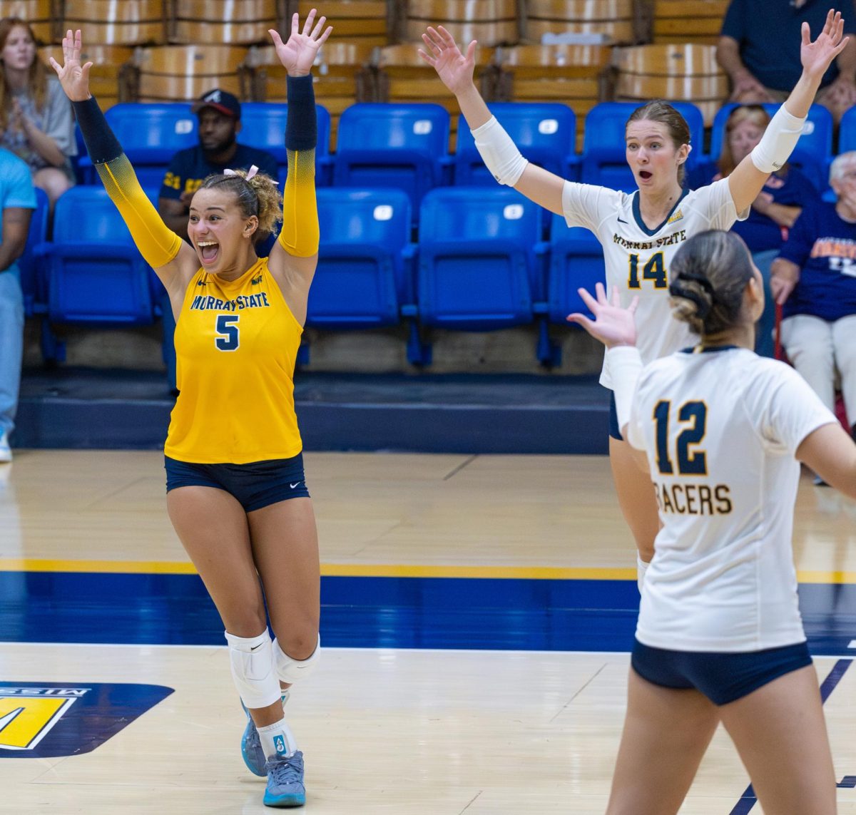 The Racers celebrate after a scoring a point. 