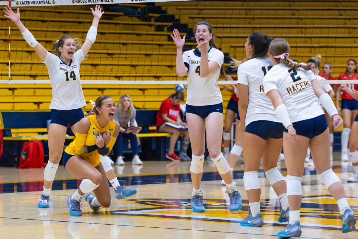 The Racers celebrate after scoring the final point and winning the game. 