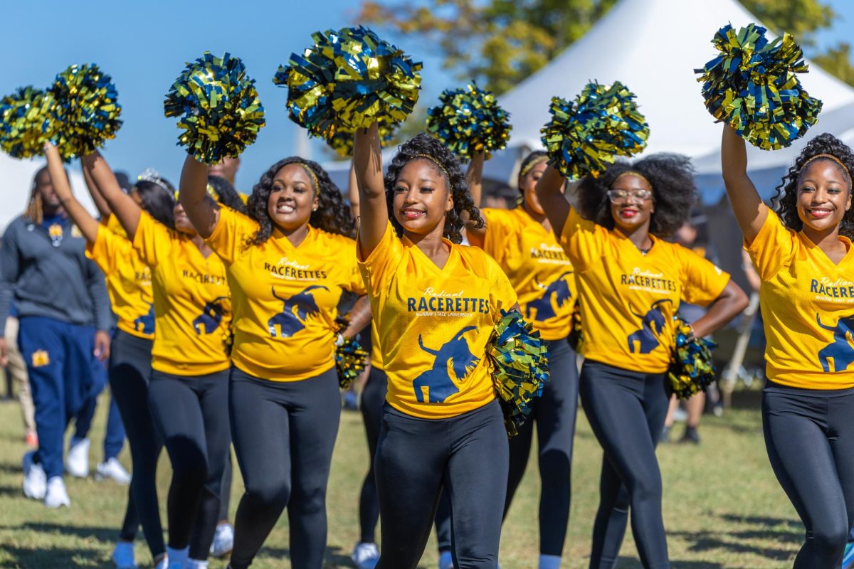 The Racerettes walk with the team during the Racer walk. 