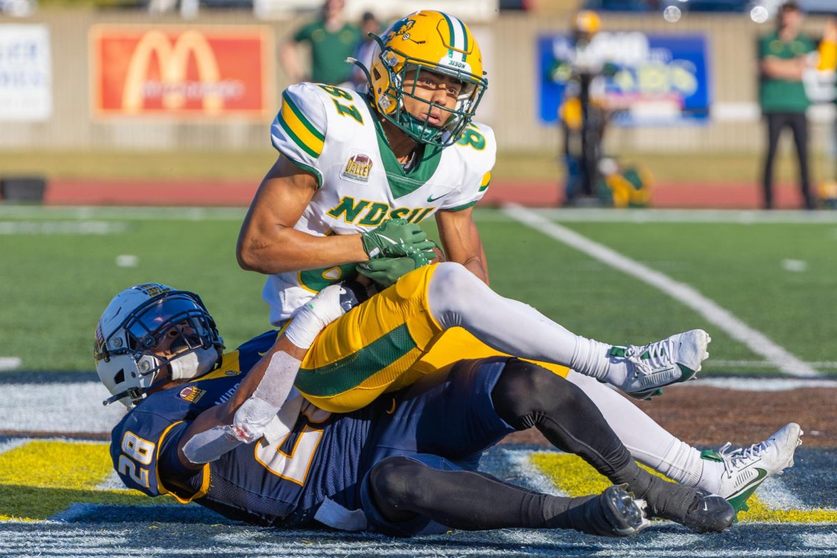 Sophomore defensive back Esteban Guillory tackles a NDSU receiver.