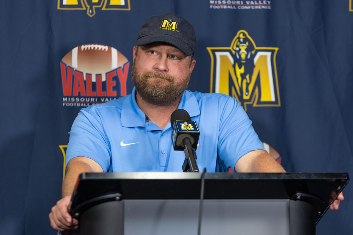 Head coach Jody Wright answers questions at the postgame press conference.