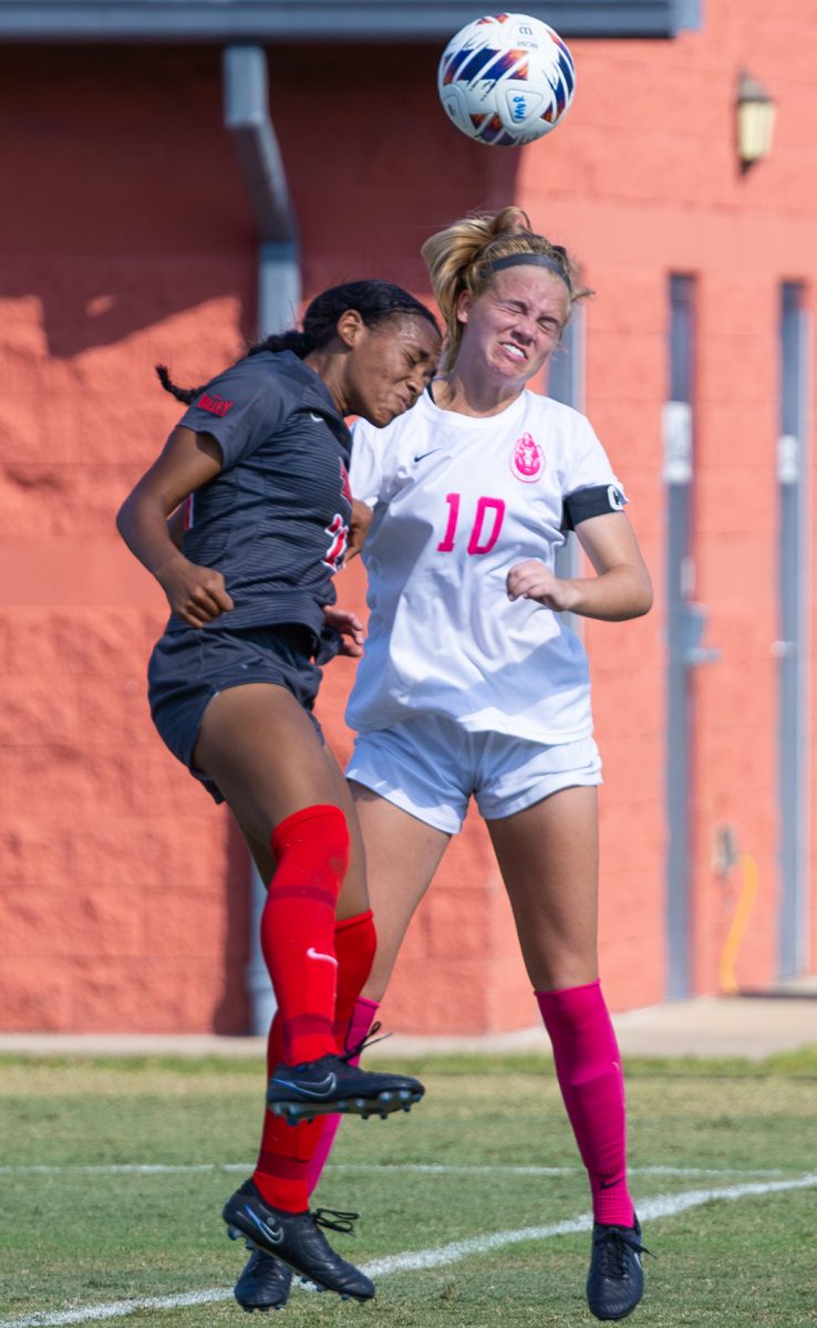 Junior forward Mary Hardy goes for a header. 