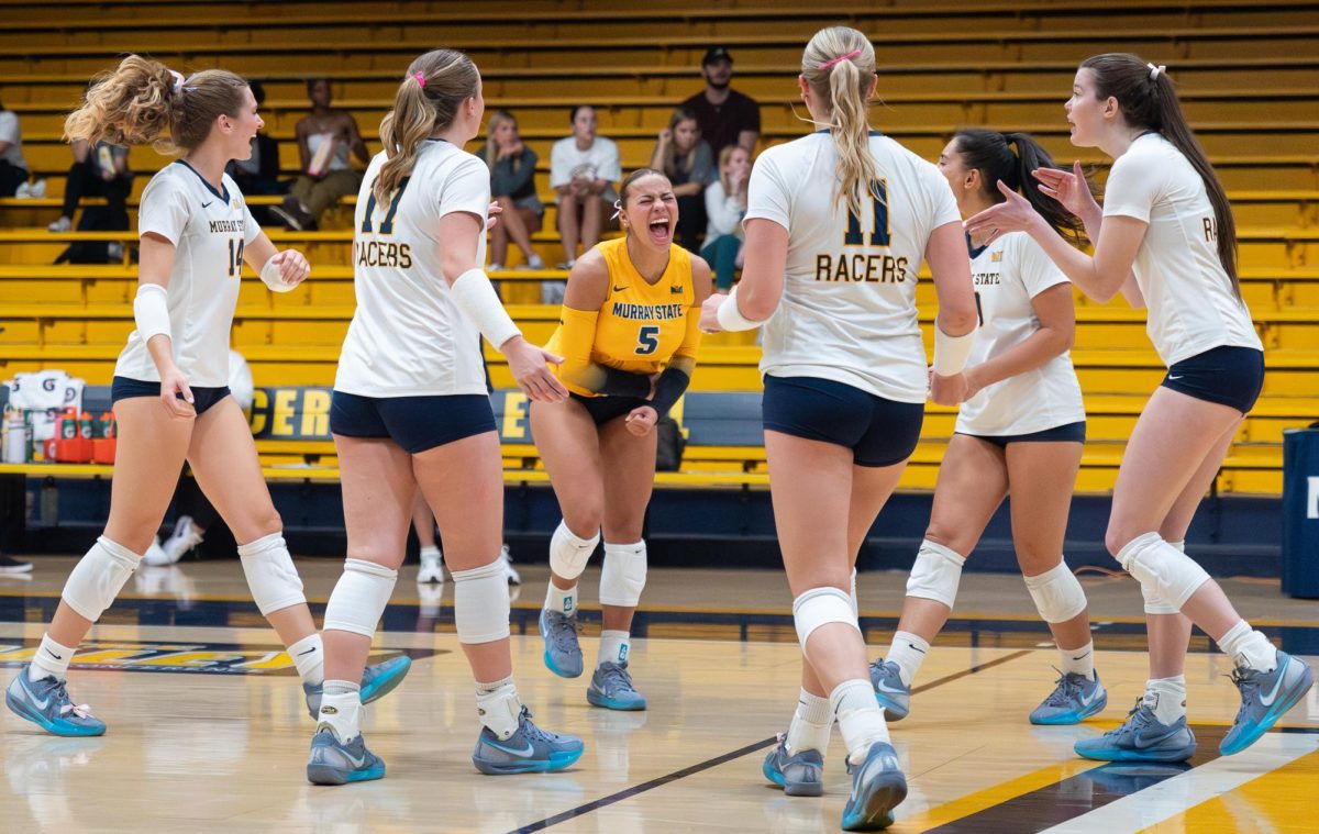 The Racers celebrate after scoring a point. 