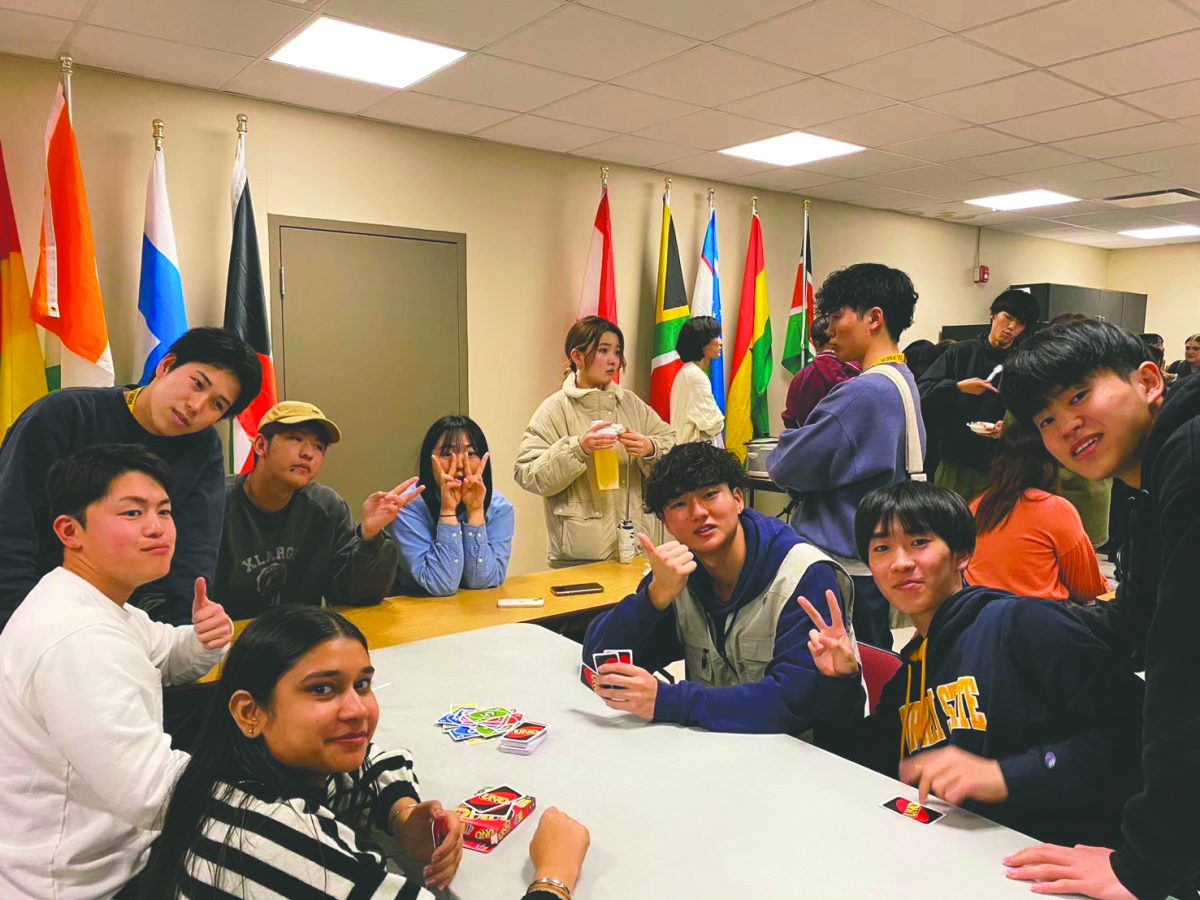 Photo provided by Murray State Japanese Club. 
Members of the Japanese club play card games during a meeting.