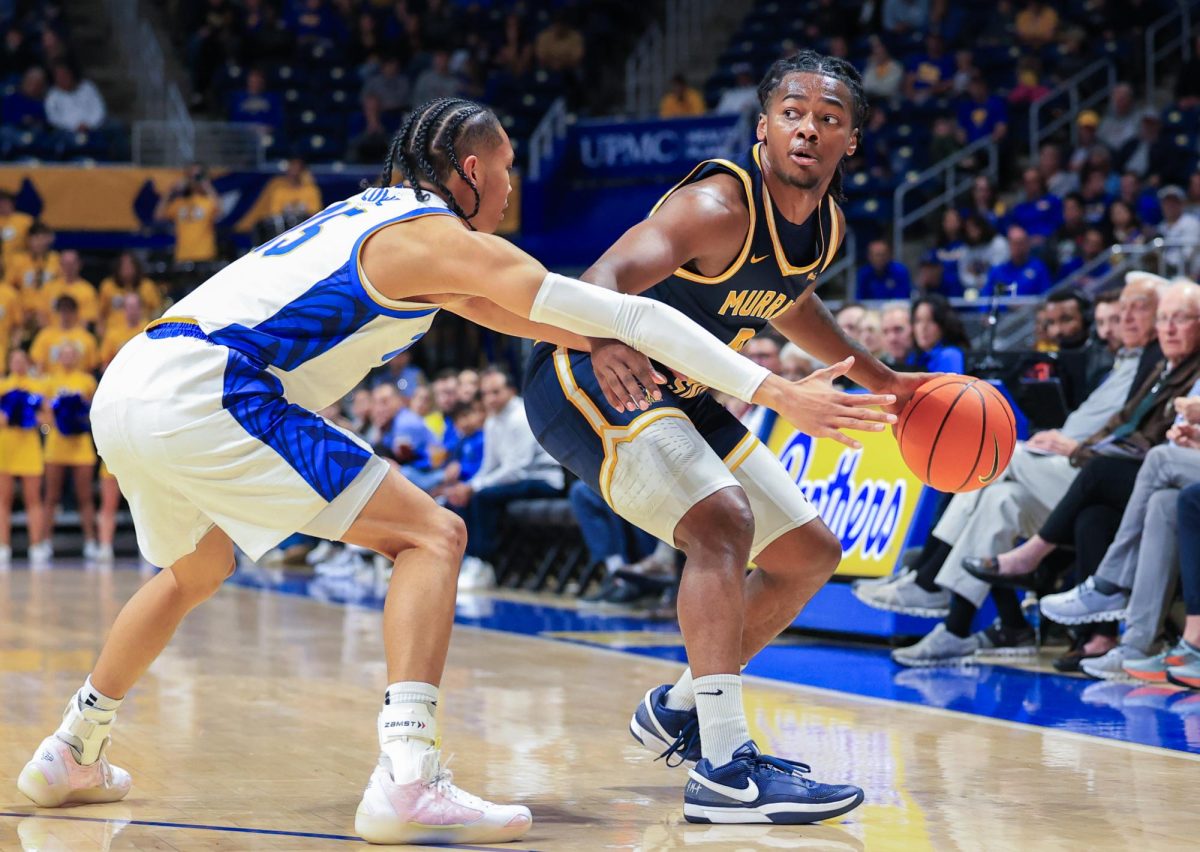 Senior guard Terence Harcum drives past a Pitt defender
Photo courtesy of Dave Winder - Murray State Athletics