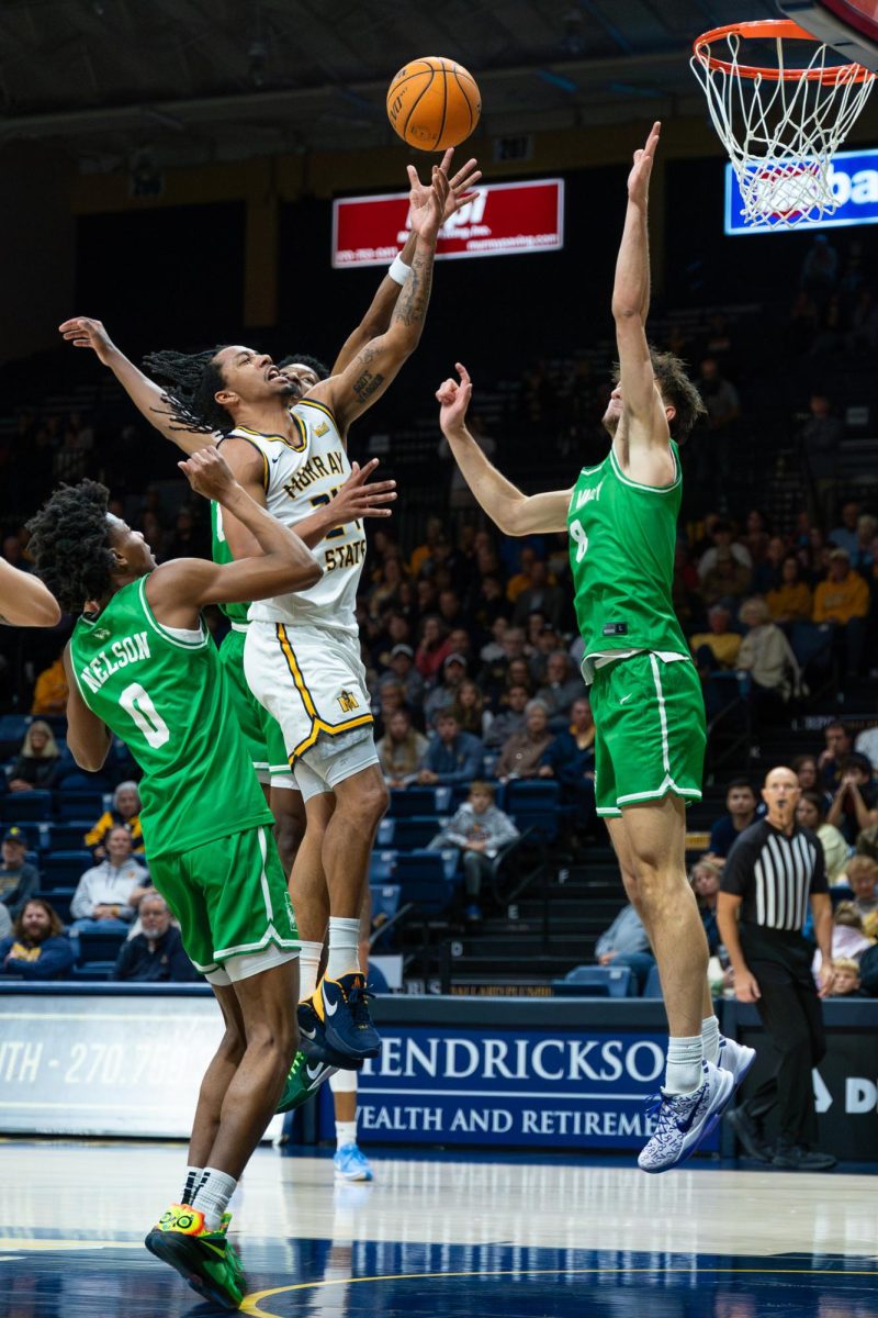 Senior guard JaCobi Wood goes for a layup. 