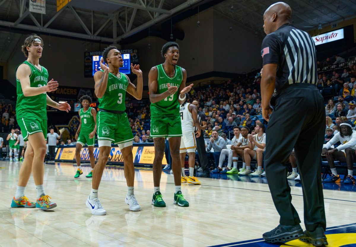 Utah Valley players argue with the referee after a foul. 