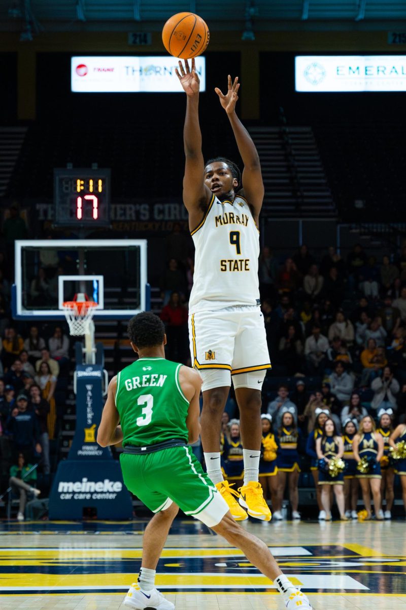 Senior guard Terence Harcum goes for a  three. 