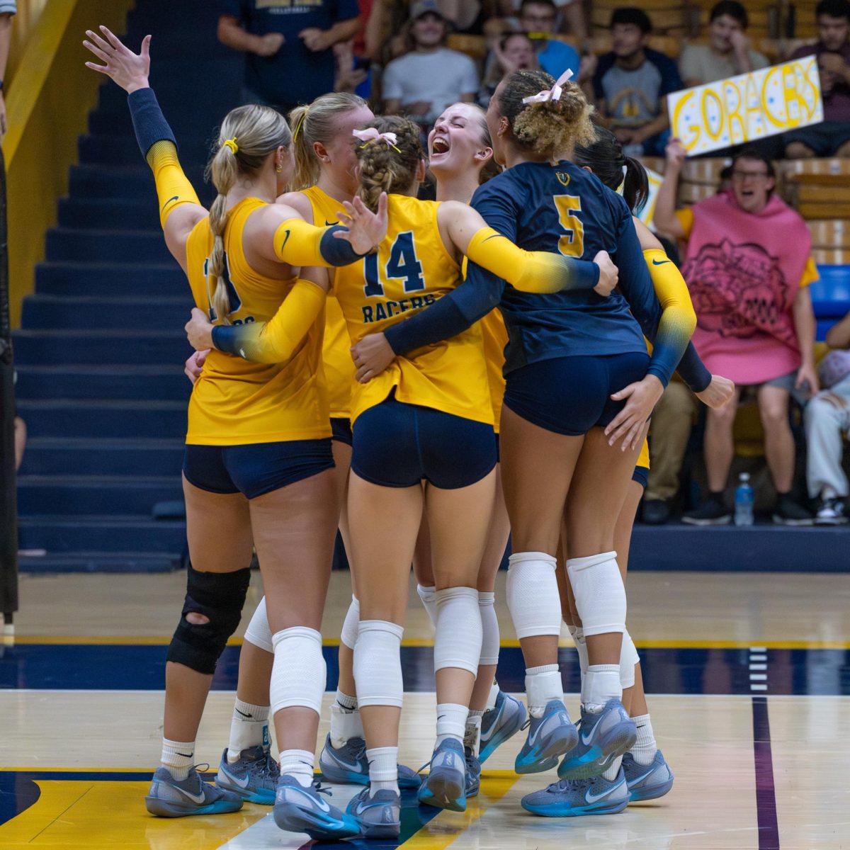 The team celebrates scoring a crucial point.