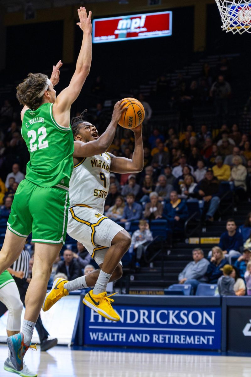 Senior guard Terence Harcum goes for a layup.