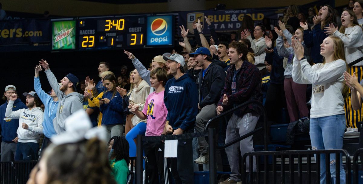 The student section cheers after Milton's dunk. 