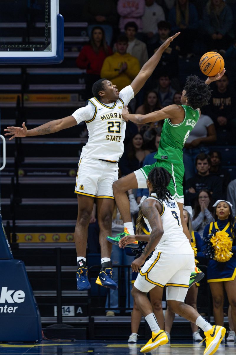 Senior forward Nick Ellington attempts to block a Utah Valley shot.