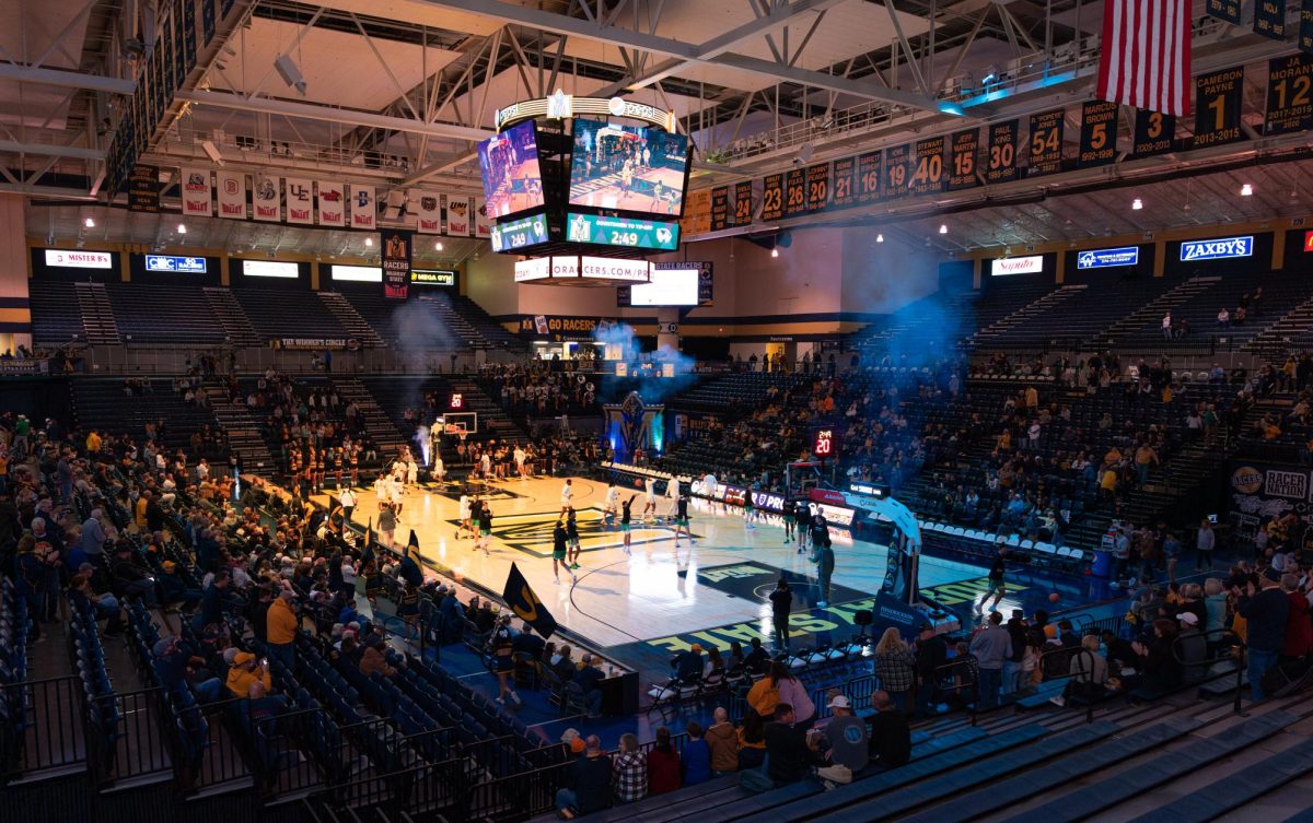 The Racers run onto the court and warm up before the game. 