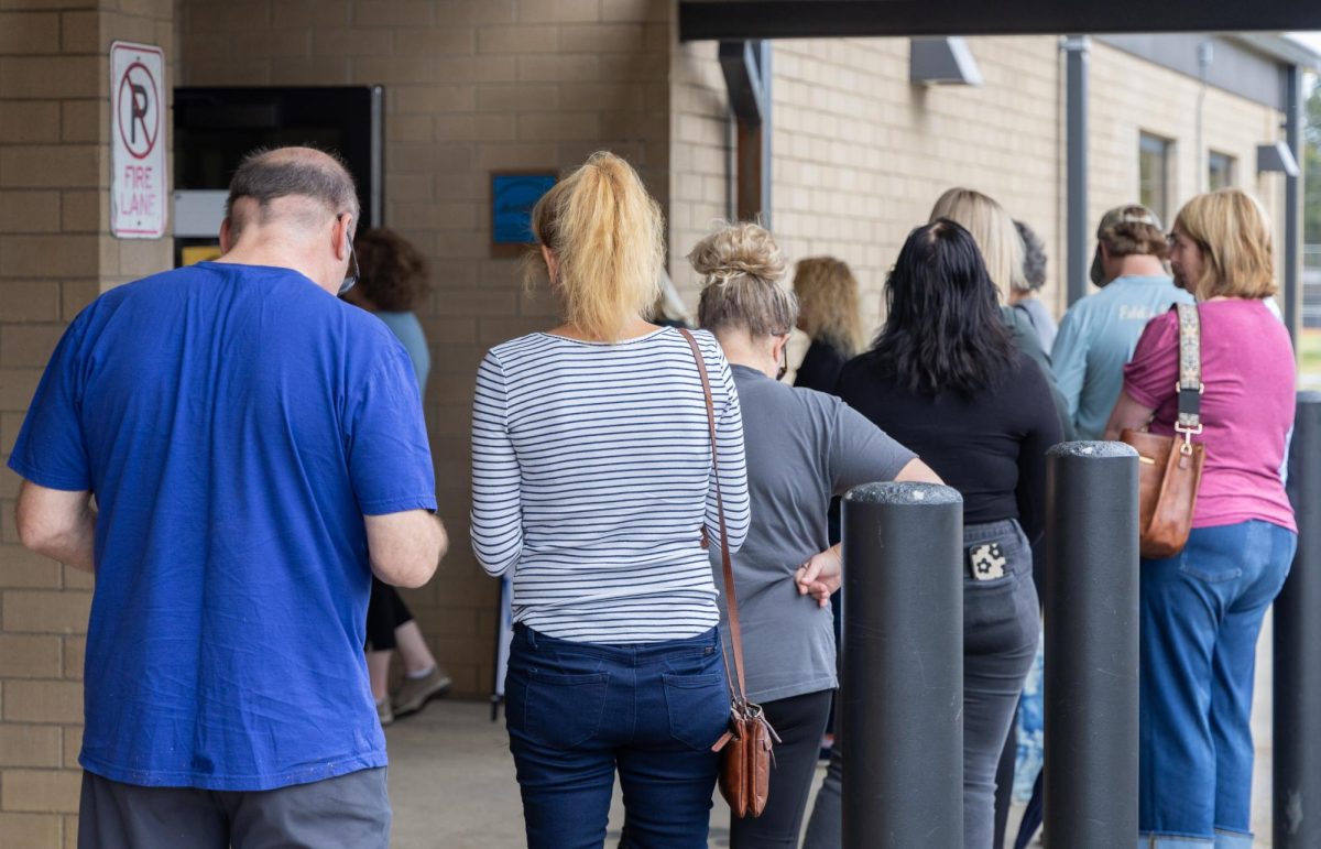 Voters wait in line outside of Murray High.