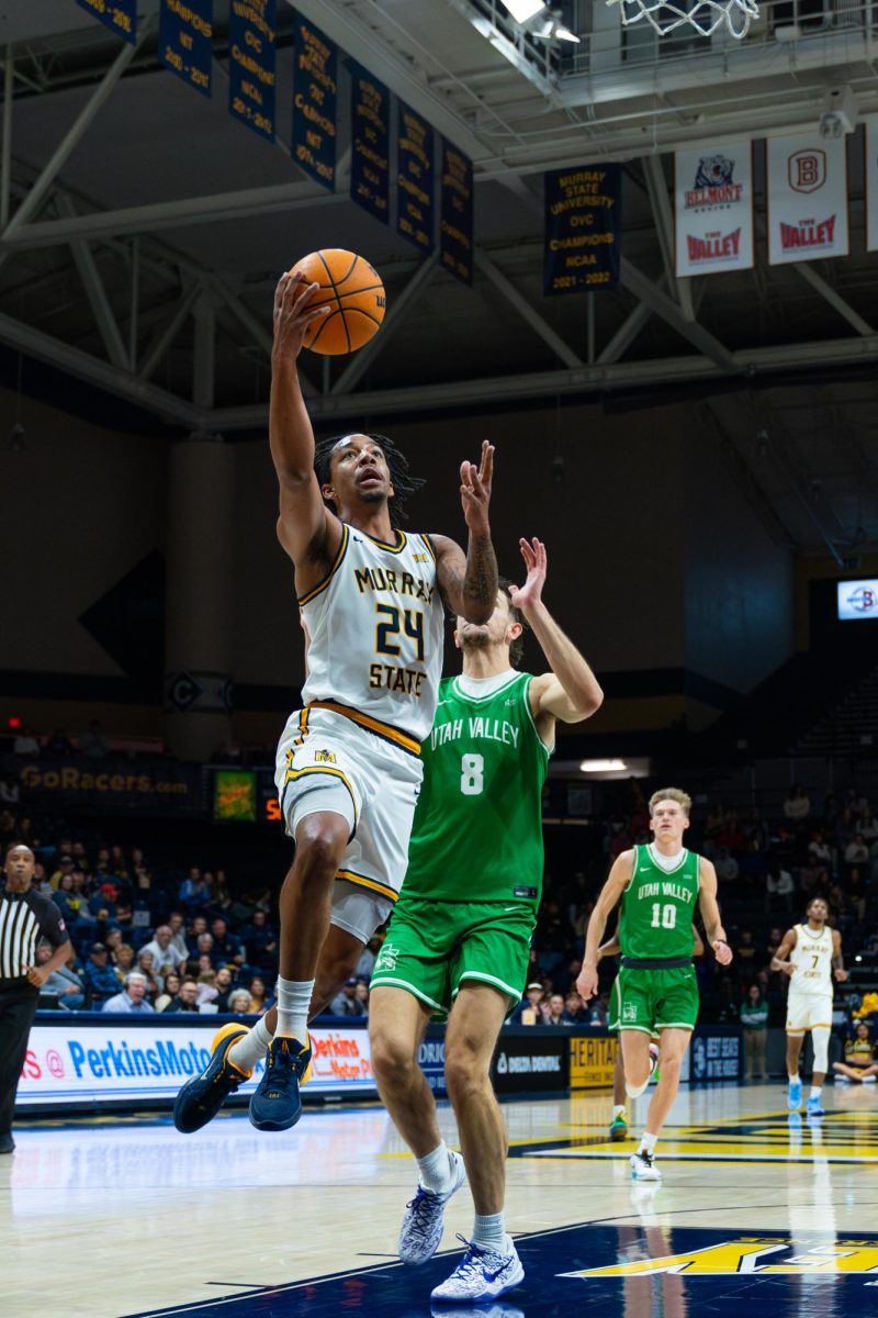 Senior guard JaCobi Wood goes for a layup.