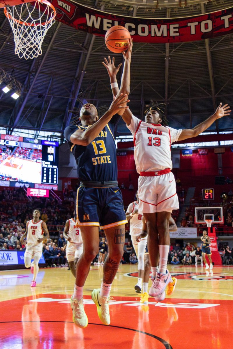 Junior forward Alden Applewhite shoots a layup.