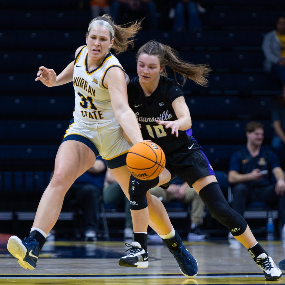 Grad. student forward Katelyn Young tries to steal the ball from an Evansville player. 