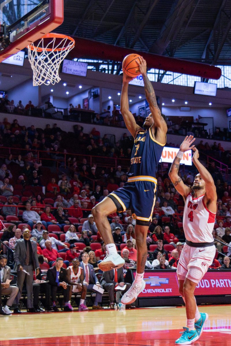 Senior forward AJ Ferguson jumps for a dunk against WKU.